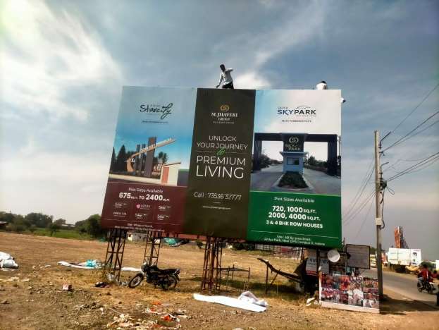 Large roadside hoarding for M. Jhaveri Group real estate projects