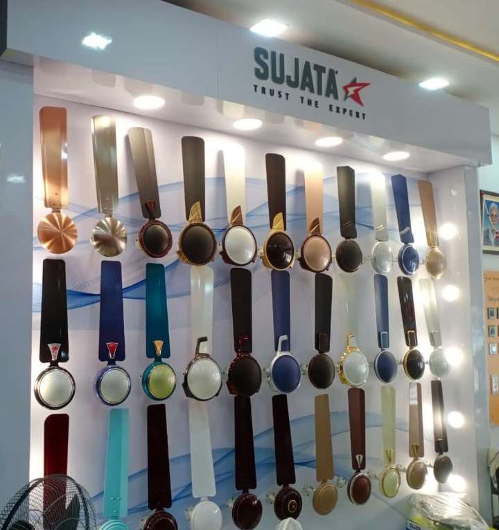 Sujata ceiling fan display wall with illuminated backdrop
